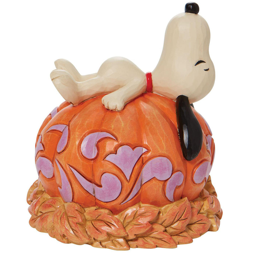 Jim Shore Snoopy Laying ontop of Carved left side