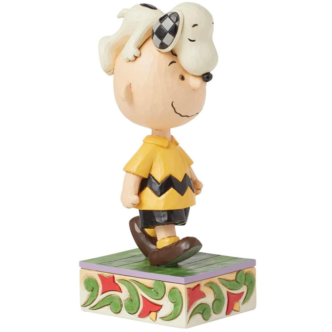 Jim Shore Snoopy on Charlie Browns Head right