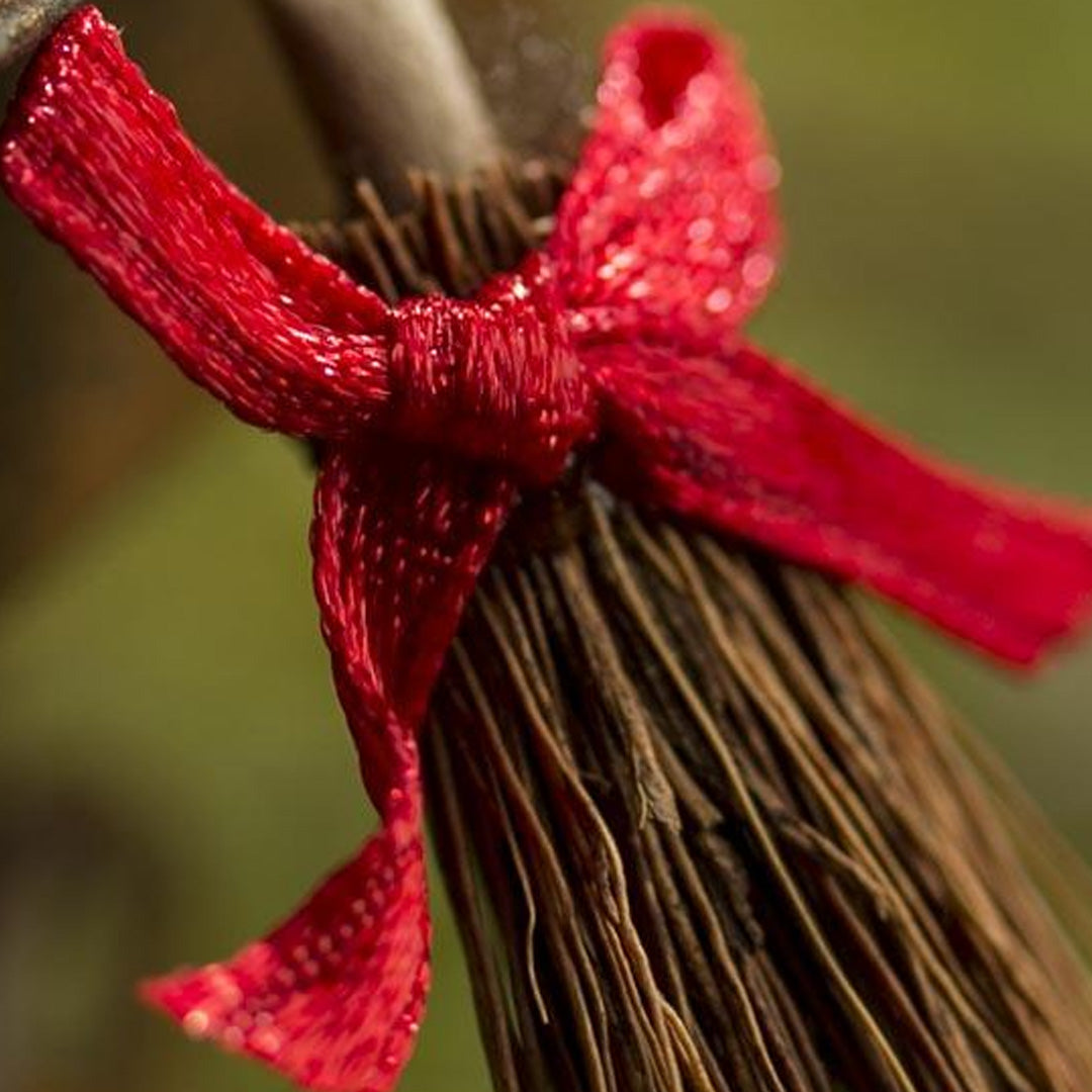 Miniature Ribboned Straw Broom close up lifestyle