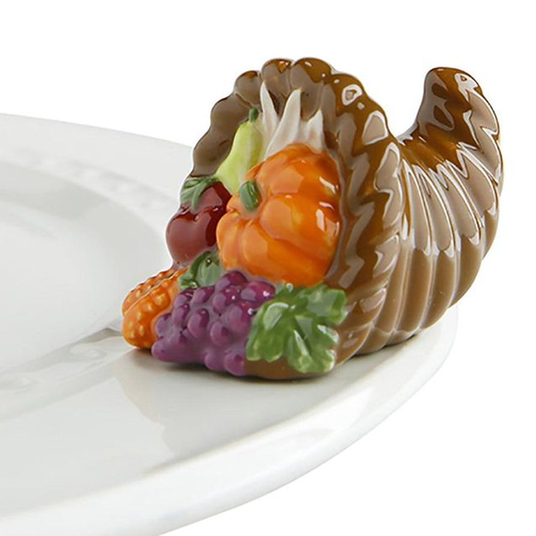 Nora Fleming Cornucopia Mini on the plate