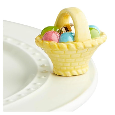 nora fleming basket w eggs on the plate