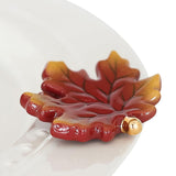 Nora Fleming Leaf Mini on the plate