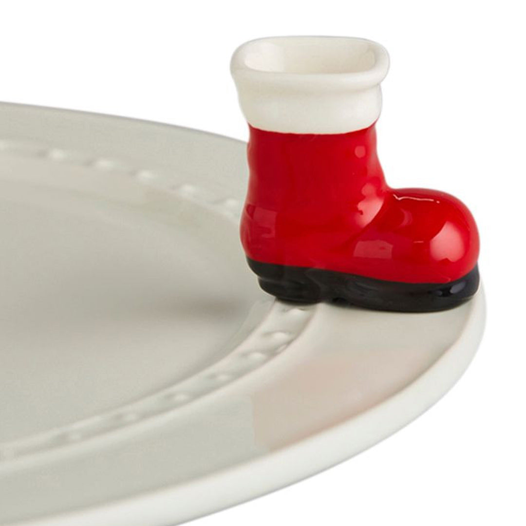 Nora Fleming Santa Boot Mini  on the plate